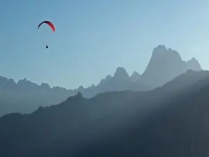 Paragliding at sunset above Accous