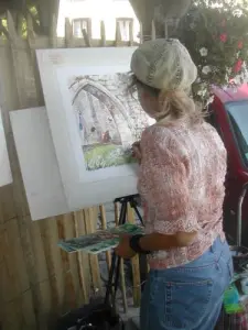 An artist in the painting in the street