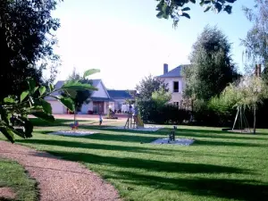 Brissarthe - Library on the left, town hall on the right and view of the play area