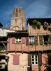 Albi - Brick-built house decorated with flowers and bell tower of the Sainte-Cécile cathedral