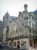 Alençon - Porch of the Notre-Dame church of Flamboyant Gothic style, facades of houses and shops of the old town