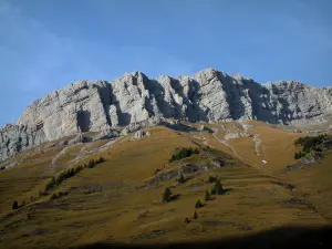 Aravis massif - From the Col des Aravis pass, view of alpine pastures (high meadows) and rock faces (cliffs) of the Aravis mountain range