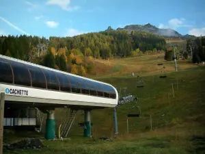 Les Arcs - Arc 1600 ski resort (winter sports) with chairlift (ski lift), trees and ski area in autumn (peripheral zone of the Vanoise national park)