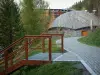 Les Arcs - Stair, trees and modern buildings of the Arc 1600 ski resort (winter sports, peripheral zone of the Vanoise national park)