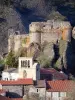 Arlempdes - Ruins of the castle on its rocky outcrop, comb bell tower of the Saint-Pierre church and houses of the medieval village