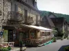 Autoire - Restaurant terrace, street and houses of the village, in the Quercy