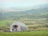 Auvergne Volcanic Regional Nature Park - Stone house surrounded by pasture; in the Massif du Sancy mountains (Monts Dore)