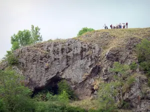 Auvergne Volcanic Regional Nature Park - Walkers on the rock of Bredons