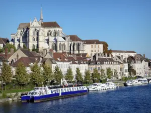 Auxerre - Gothic-style Saint-Germain abbey church, houses in the Marine district, Yonne river and boats moored at the Marine quay