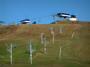 Avoriaz - Alpine pasture (high meadow0 and ski lifts of the ski resort (ski area) in Haut-Chablais