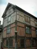 Bar-sur-Seine - Renaissance house (residence mixing bricks, timber framings and carved beams) with a statue of holy Roch and his dog
