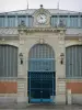 Beaucaire - Entrance of the covered market topped by a clock