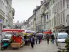 Belley - Stalls of the Saturday morning market and facades of houses in the Grande Rue street