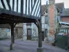 Beuvron-en-Auge - Half-timbered houses, one with wooden pillars, in the Pays d'Auge area