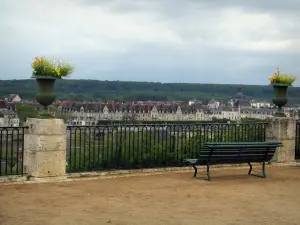 Blois - Terrace of the Bishop's palace gardens with a bench and flowers, a view of the houses of the opposite bank