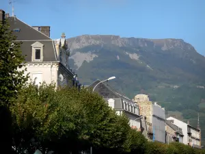 La Bourboule - Buildings of the spa resort, trees and mountain; in the Auvergne Volcanic Regional Nature Park, in the Monts Dore mountain area 