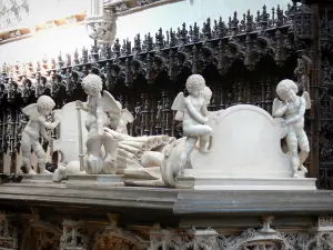 Brou Royal Monastery - Inside the Brou church of Flamboyant Gothic style: tomb of Philibert le Beau (duke of Savoy) and wooden stalls in the background