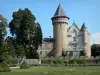 Busset castle - French-style formal garden, Orion tower and main building of the castle