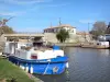 Canal du Midi - Homps port with its moored boats and bridge over the canal