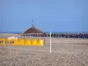 Le Cap-d'Agde - Sandy beach of the seaside resort, beach-volleyball net, breakwater (cliffs) and the Mediterranean Sea