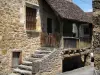 Carennac - Casa de piedra con un toldo