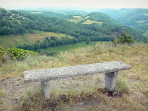 Carlat rock - Bench at the top of the rock of Carlat overlooking the surrounding green landscape