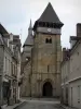 Chambon-sur-Voueize - Sainte-Valérie abbey church of Romanesque Limousin style with its two bell towers, street and houses of the city