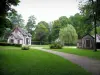 Château de Chantilly - Park: the Hamlet and its half-timbered huts, paths lined with lawns and trees