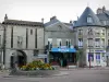 Château-Chinon - Porte Notre-Dame gate, flower bed, shops and facades of Château-Chinon (Ville); in the Regional Natural Park of Morvan