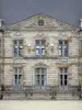 Château de Courson - Facade of the château topped by a triangular pediment; in the town of Courson-Monteloup