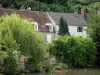 Châtillon-en-Bazois - Houses and trees along River Aron