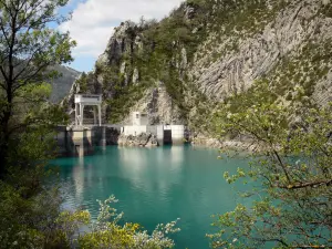 Chaudanne lake - Chaudanne dam, emerald-coloured lake (water reservoir), trees along the water and mountain; in the Verdon Regional Nature Park