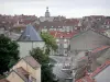 Chaumont - Arse tower, roofs of houses in the old town, and belfry tower of the Caisse d'Épargne bank in the background