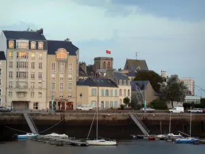 Cherbourg-Octeville - Port with its small moored leisure boats, quay, bell tower of the Sainte-Trinité basilica, houses and buildings of the city