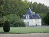 Clairvaux castle - Pavilion of the castle, lawn, cut shrubs and trees