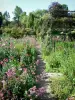 Claude Monet’s house and gardens - Monet's garden, in Giverny: Norman enclosure: small path lined with flower beds