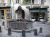 Clermont-Ferrand - Fountain, shops and houses of the Terrail square