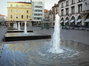 Clermont-Ferrand - Water fountains of the Jaude square, shops and facades of buildings