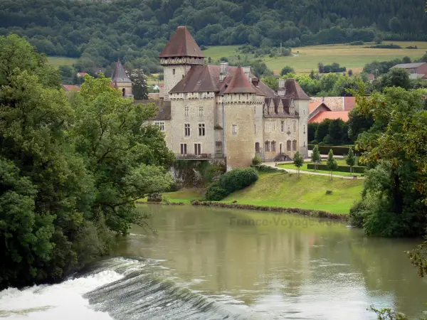 Cléron castle - Fortified castle, Loue river, trees along the water