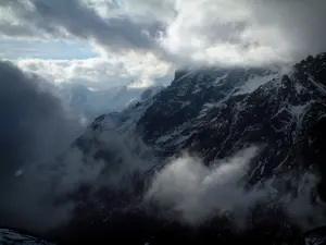 Col du Galibier pass - Grande Alpes (Alps) road: snowy mountains and clouds