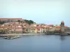Collioure - Vermilion coast: view of the steeple of the Notre-Dame-des-Anges church and colorful facades of the old town on the Mediterranean sea