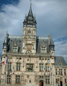 Compiègne - Town hall (building of Flamboyant Gothic style) and its belfry with a cloudy sky
