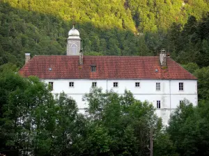 Consolation rock formations - Notre-Dame de Consolation, former convent of the minim religious order, surrounded by trees