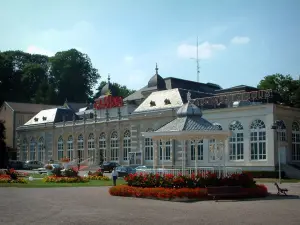 Contrexéville - Parc Thermal spa garden with a bandstand decorated with flowers, Casino in background