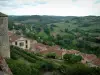 Cordes-sur-Ciel - View of gardens, roofs of the houses in the city and surrounding hills