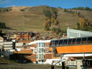 Courchevel - Chairlift (ski lift), chalets, residences and ski area of the ski resort (winter sports)