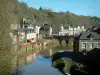 Dinan - Port with its small bridge and its boats, stone houses and trees overhanging the set