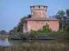 Dombes - Plantay tower (brick keep) at the edge of a pond