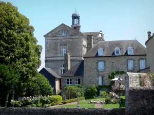 Domfront - Garden of a house, and Town Hall of Domfront in the background