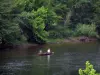 Dordogne valley - The River Dordogne, fishermen on a boat and trees along the water, in Périgord